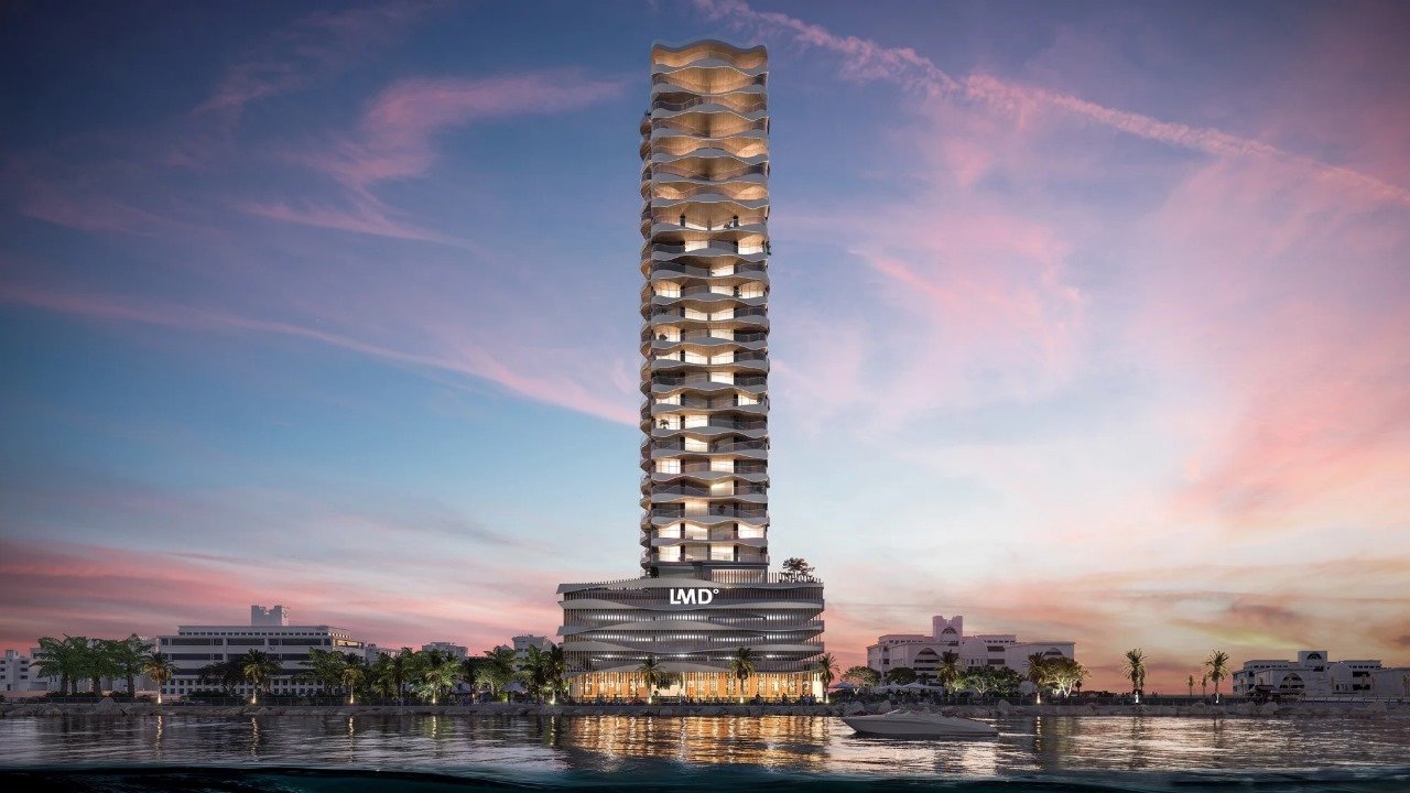 The Pier Residence - tall timber-clad tower at sunset beside the water