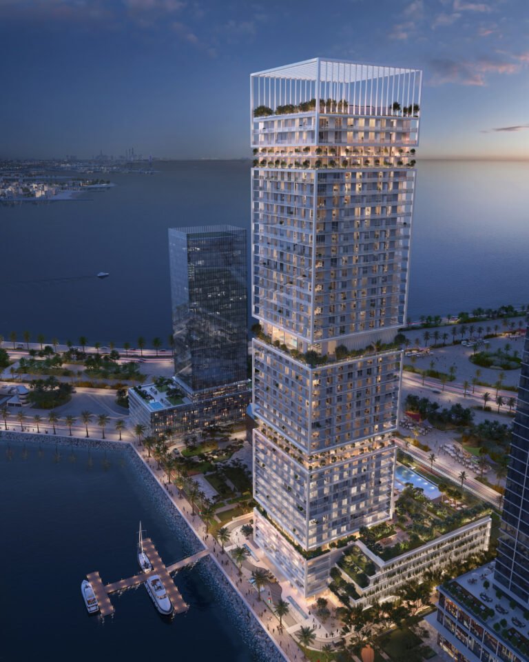 Saria by Beyond - aerial dusk view of the tower beside the water