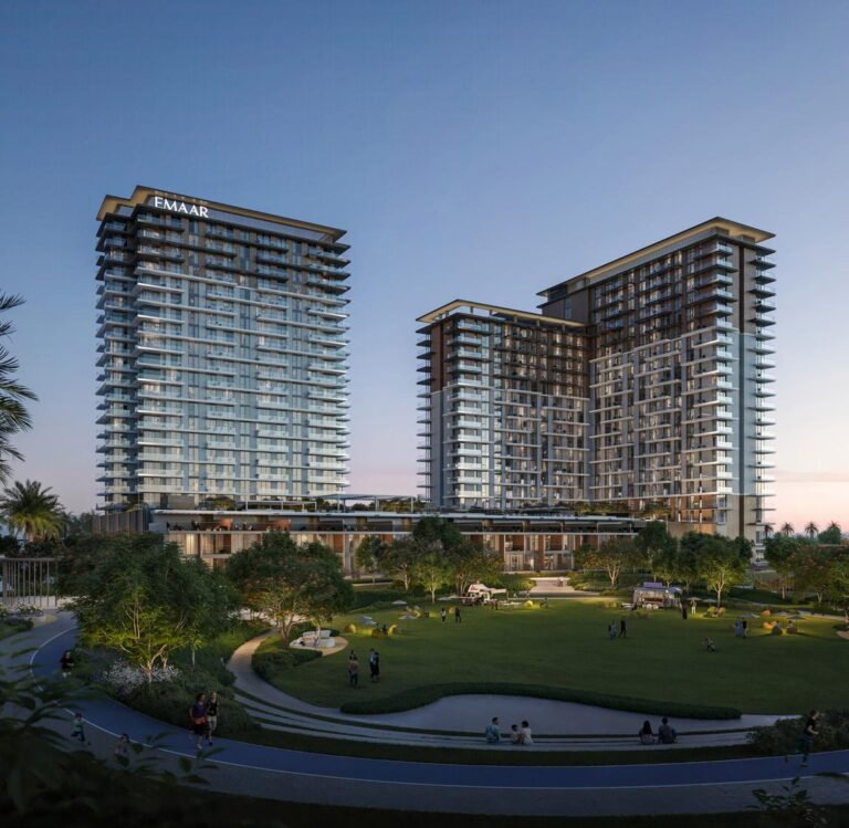 Parkwood at Dubai Hills Estate - twin residential towers at dusk with landscaped park