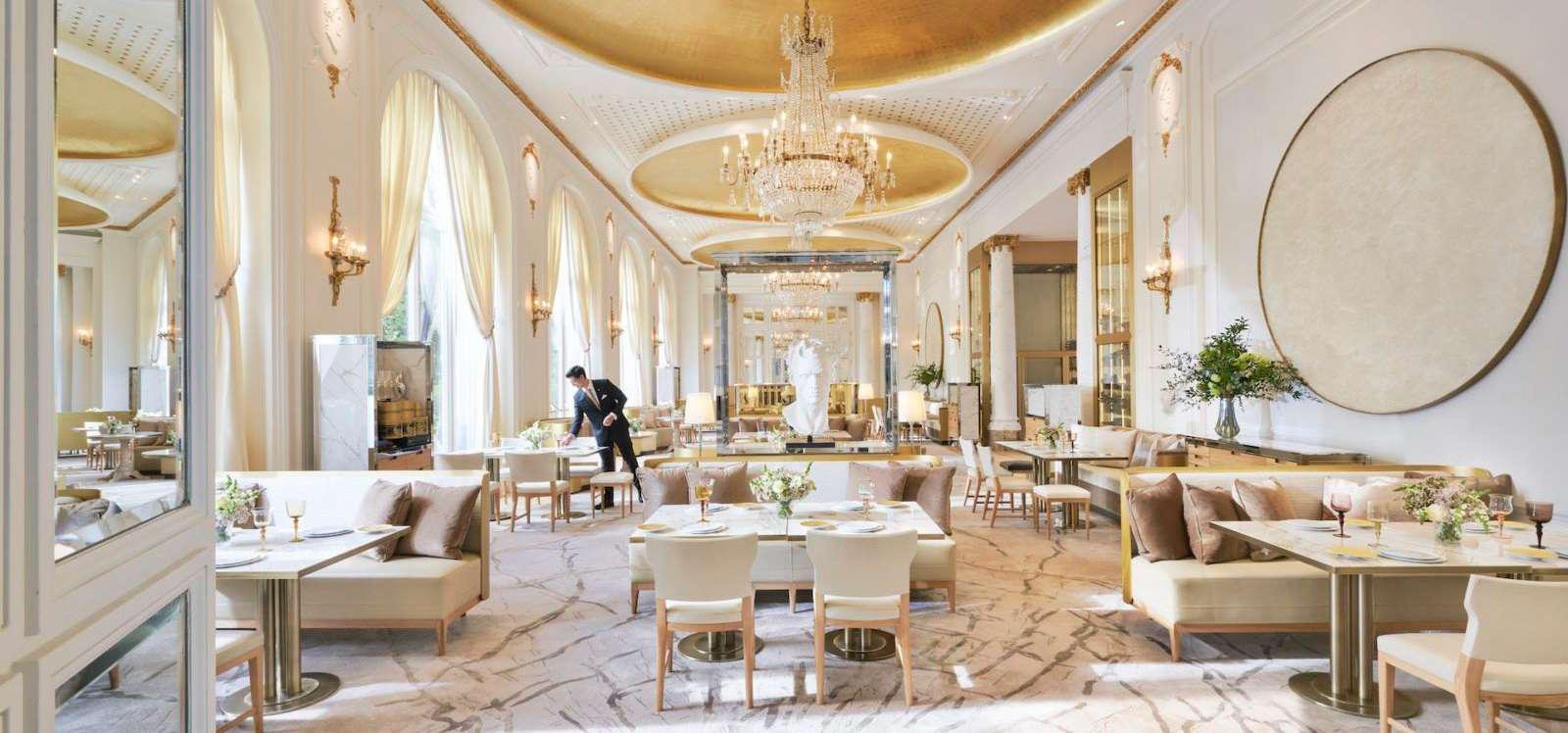 Vela Viento by Omniyat - grand lounge with chandelier and marble floor