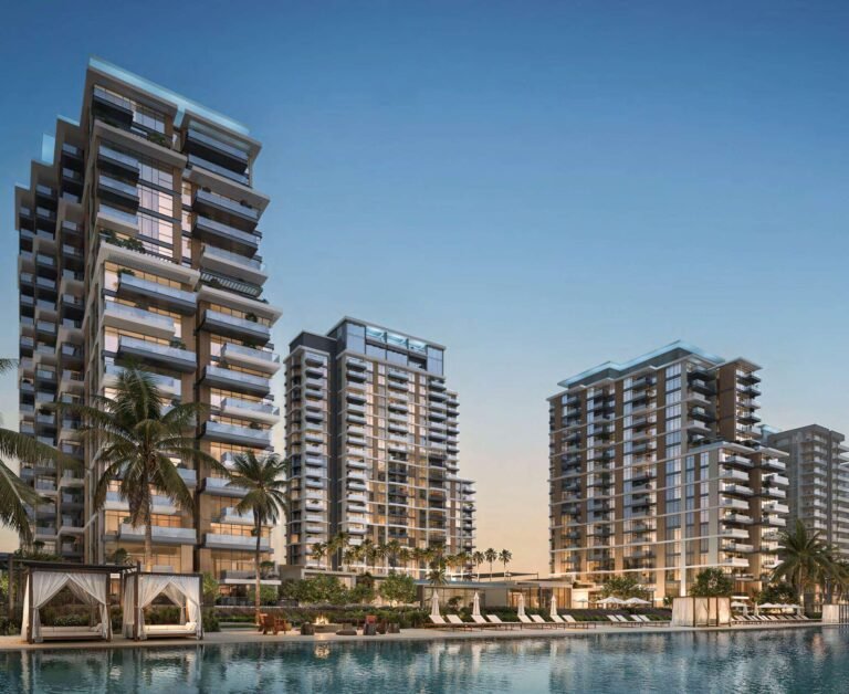 Naya Residences by Nakheel - residential towers with palm trees at dusk