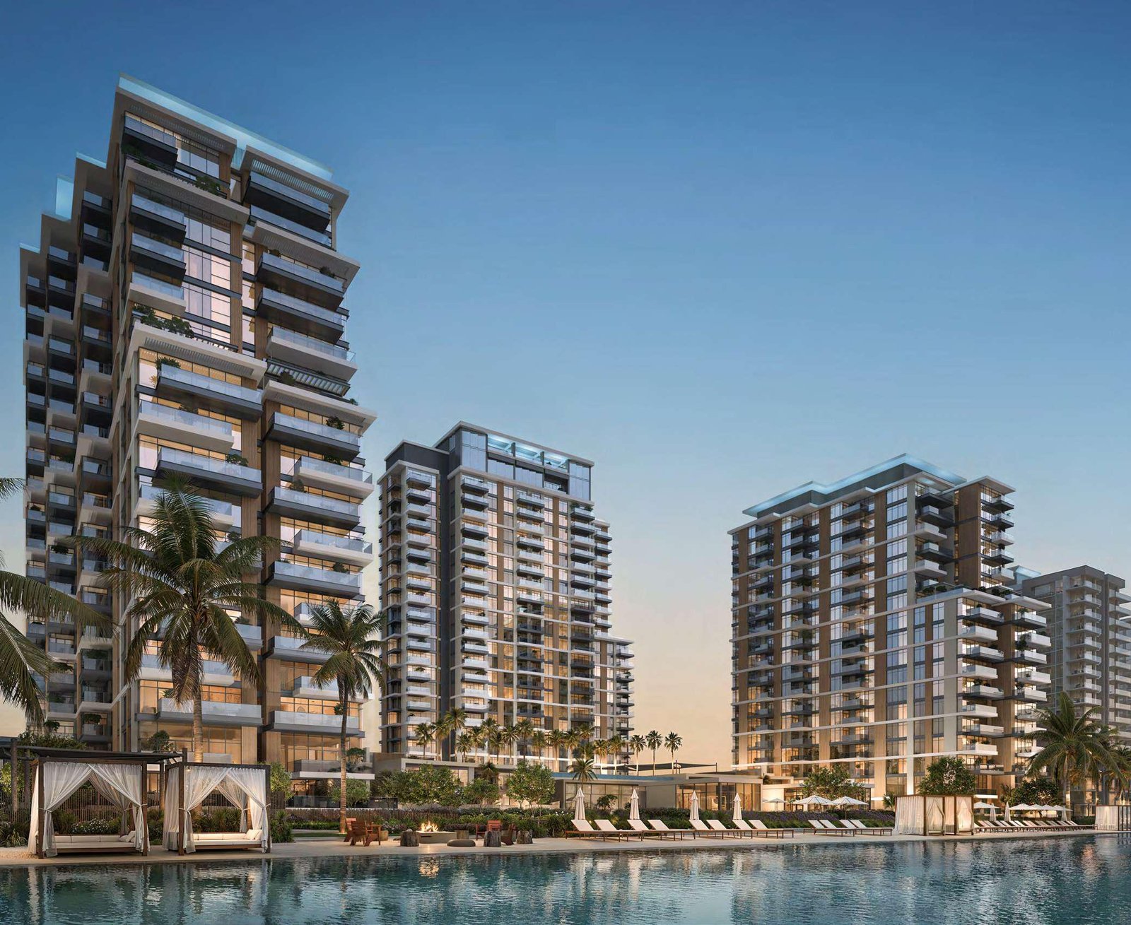 Naya Residences by Nakheel - residential towers with palm trees at dusk