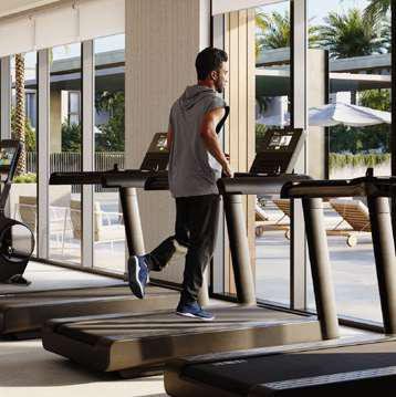 Grand Polo Club & Resort - resident on a treadmill in the gym