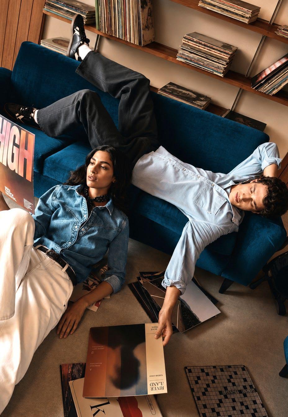 Raw District by Imtiaz Development - residents relaxing on a blue sofa