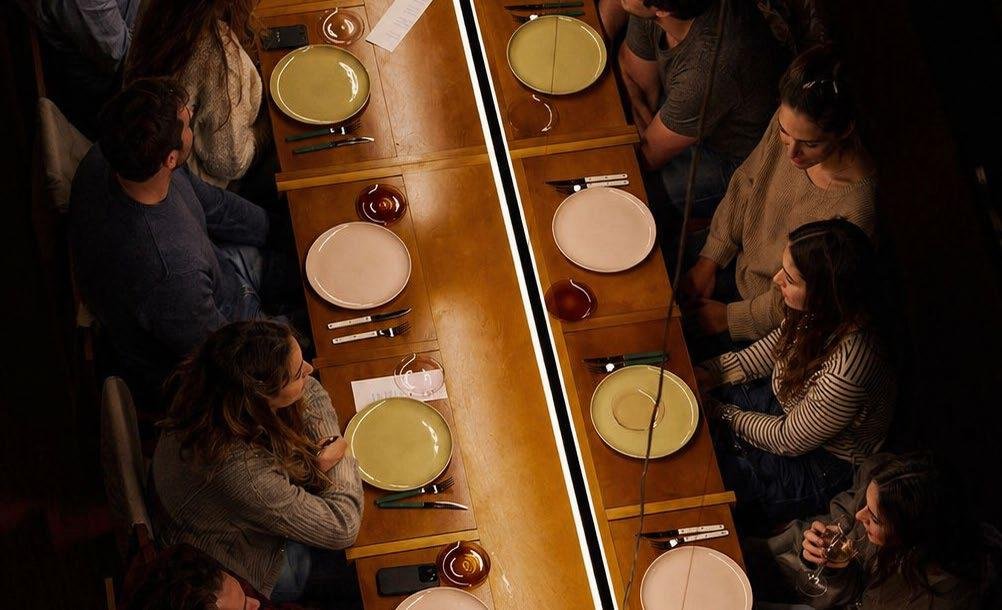 Raw District by Imtiaz Development - residents sharing a communal dining table