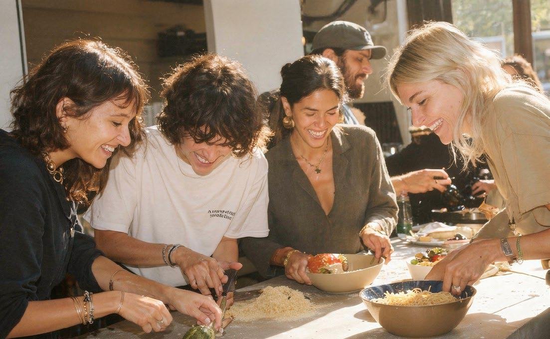 Raw District by Imtiaz Development - friends cooking together in a shared kitchen